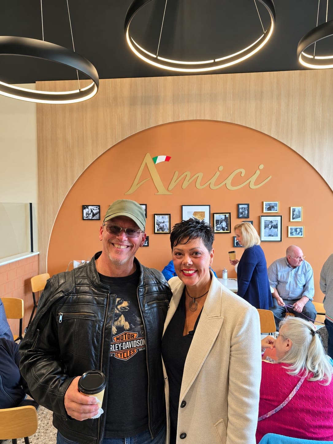 Ivana White with a resident holding a coffee at Amici.